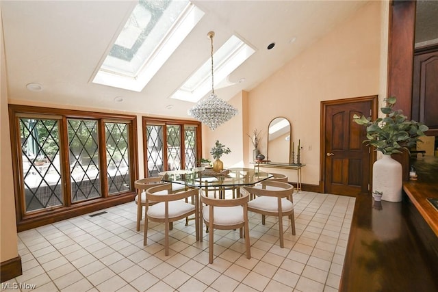 dining room featuring a skylight, high vaulted ceiling, a healthy amount of sunlight, and light tile patterned floors