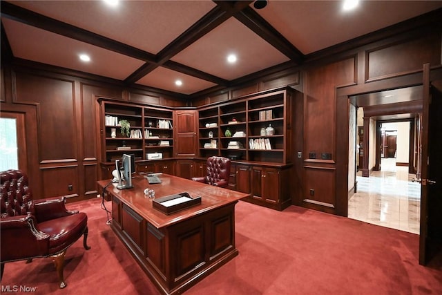 carpeted office space with beam ceiling, wooden walls, built in shelves, and coffered ceiling