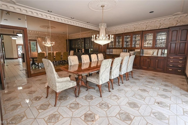 dining area with an inviting chandelier and crown molding