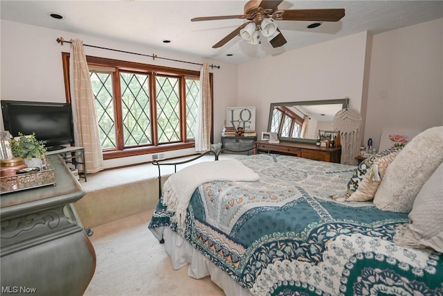 carpeted bedroom featuring ceiling fan