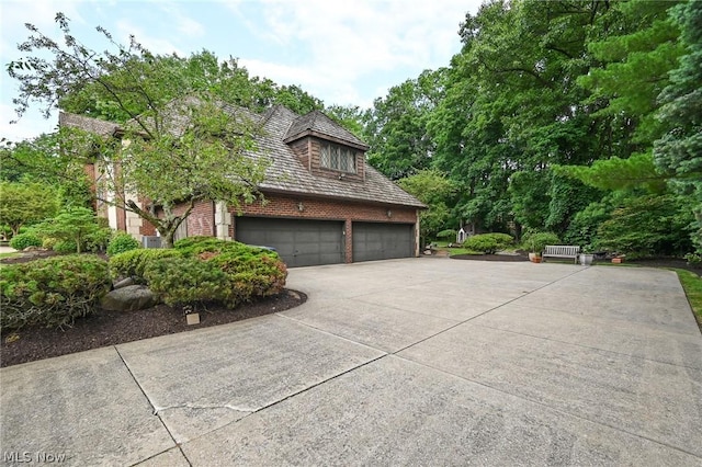 view of side of property featuring a garage