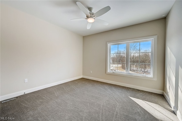 empty room with carpet floors and ceiling fan