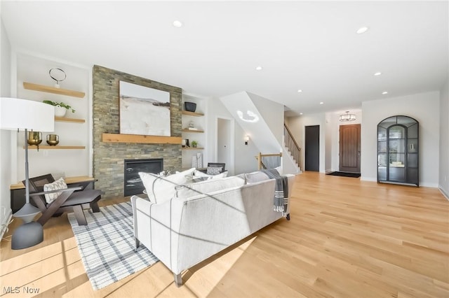 living room featuring light hardwood / wood-style floors and a fireplace