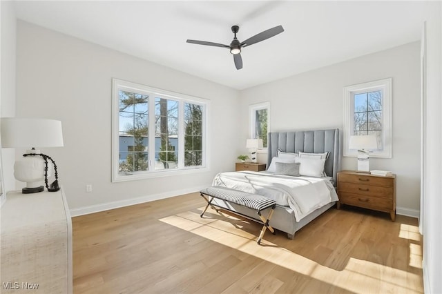 bedroom featuring ceiling fan and light hardwood / wood-style flooring