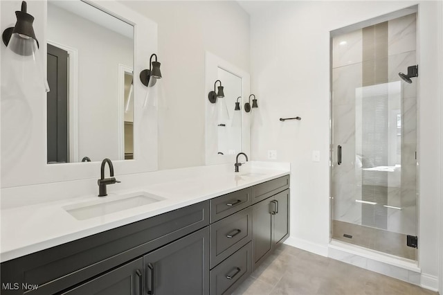 bathroom with tile patterned flooring, a shower with shower door, and vanity