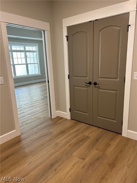 944 Queen Anne Dr NW, Massillon, OH 44647 - hallway featuring light wood-type flooring