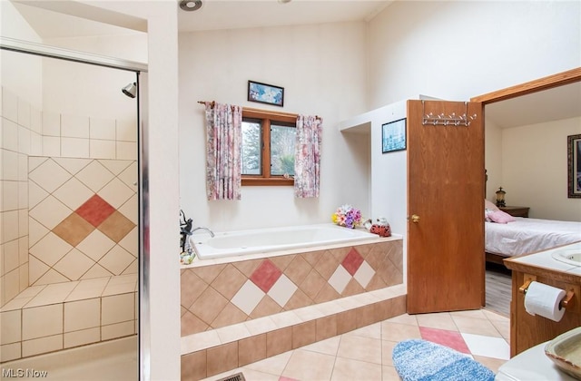 bathroom with tile patterned flooring, independent shower and bath, and lofted ceiling