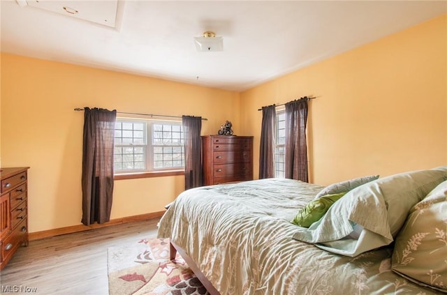 bedroom with light wood-type flooring