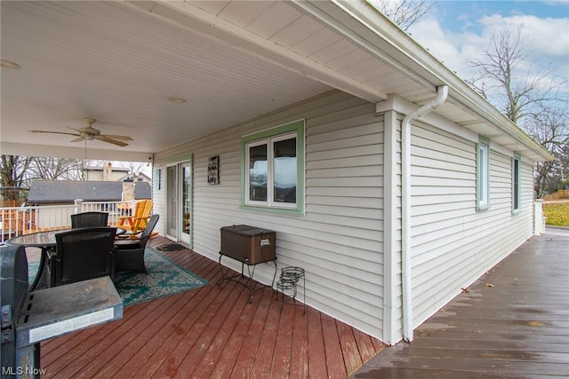 wooden terrace featuring ceiling fan