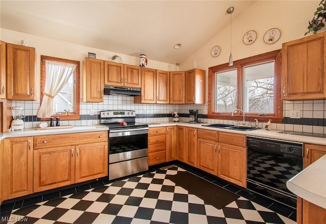 kitchen with stainless steel range with electric stovetop, sink, black dishwasher, hanging light fixtures, and lofted ceiling