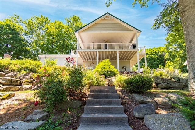 rear view of property with a balcony