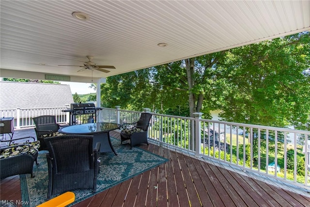 wooden terrace featuring ceiling fan