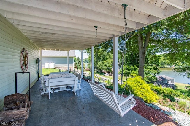 view of patio / terrace with a water view