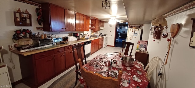 kitchen featuring ceiling fan, white appliances, and light tile floors