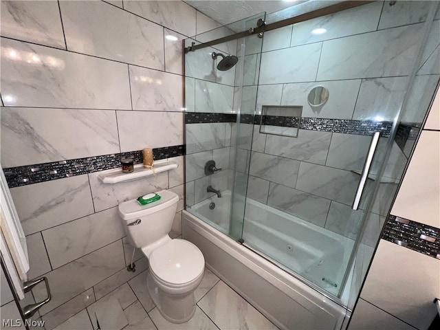 bathroom with enclosed tub / shower combo, tile flooring, tile walls, and toilet