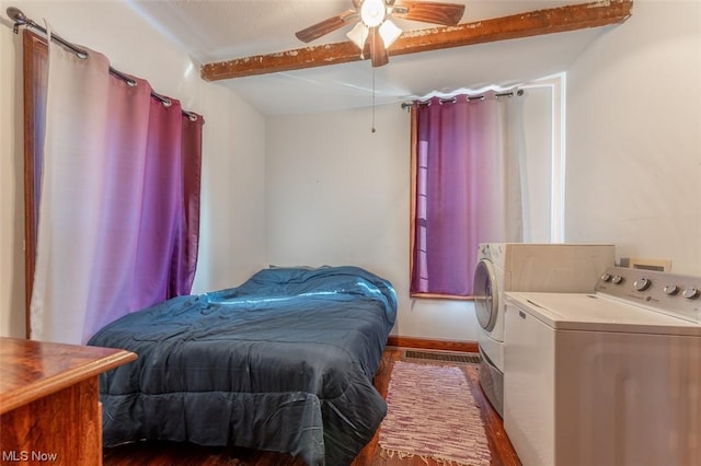 bedroom with washing machine and dryer, ceiling fan, beam ceiling, and dark wood-type flooring