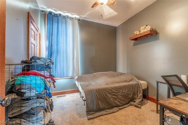 bedroom with ceiling fan and carpet flooring