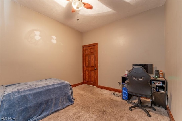 carpeted bedroom featuring ceiling fan and vaulted ceiling