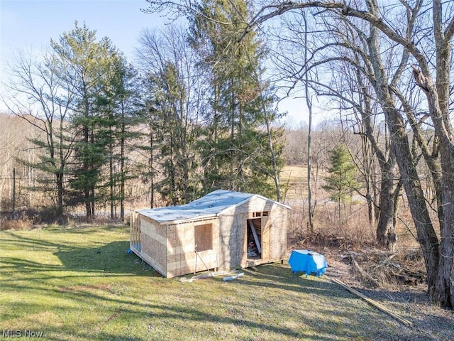 view of outdoor structure with a yard