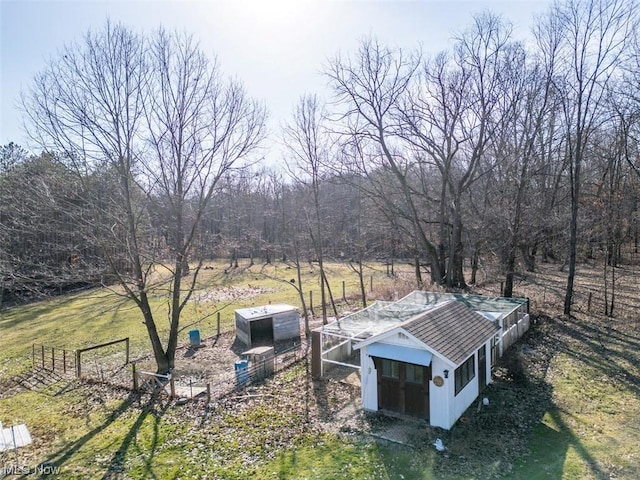 exterior space featuring a rural view and an outdoor structure