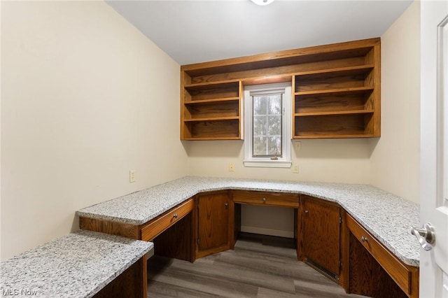 office area with hardwood / wood-style floors and built in desk