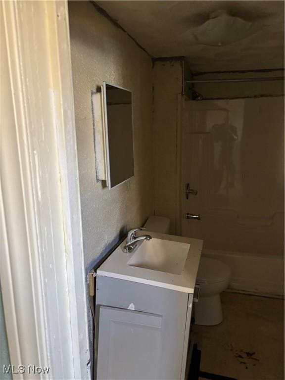 full bathroom featuring shower / bathtub combination, vanity, and toilet