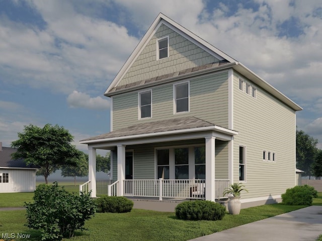 view of front facade featuring a front yard and covered porch