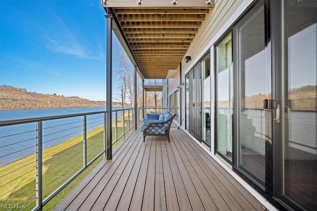 balcony featuring a water view