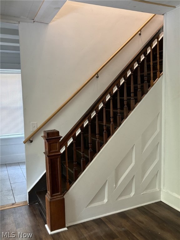 staircase featuring hardwood / wood-style flooring