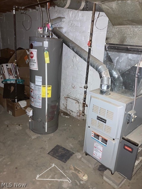 utility room featuring gas water heater