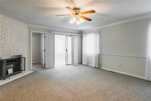 unfurnished living room with a textured ceiling, carpet, crown molding, and ceiling fan