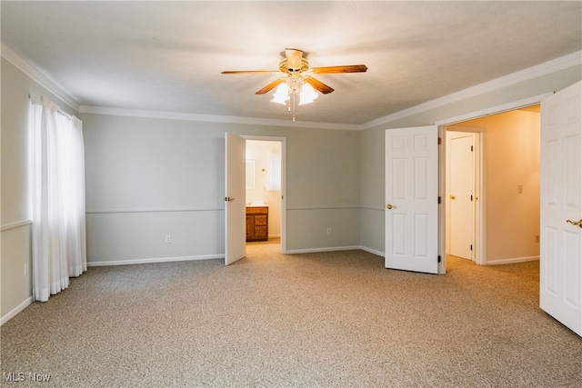 unfurnished bedroom with crown molding, connected bathroom, ceiling fan, and light colored carpet