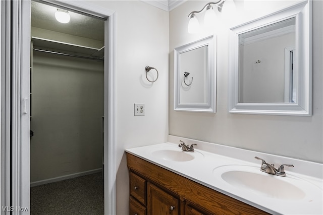 bathroom featuring a textured ceiling and vanity