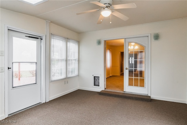 carpeted empty room with ceiling fan