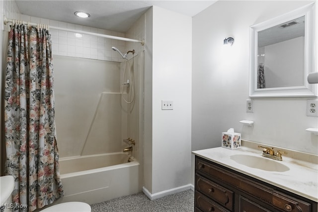 full bathroom featuring shower / bath combo, vanity, and toilet