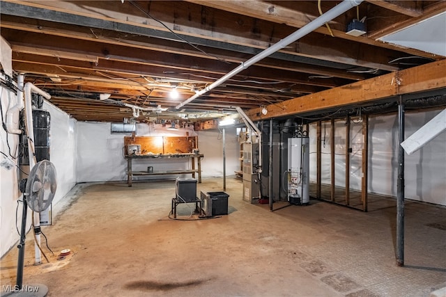 basement featuring gas water heater and heating unit