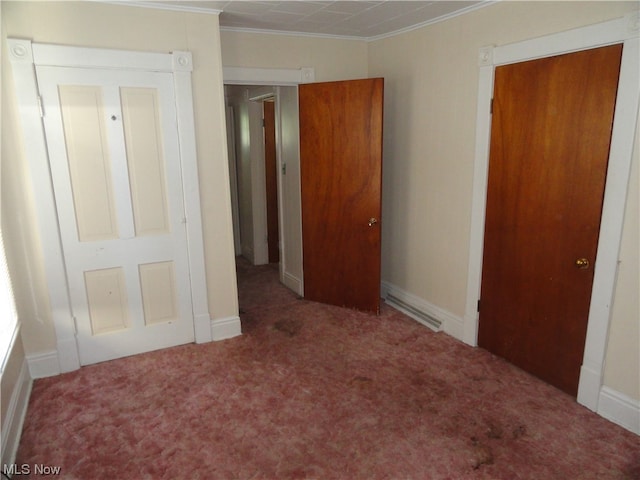 unfurnished bedroom with a closet and dark colored carpet