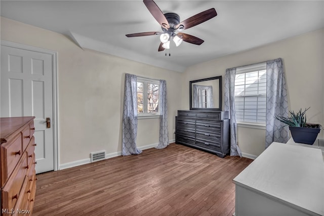 bedroom featuring hardwood / wood-style flooring and ceiling fan