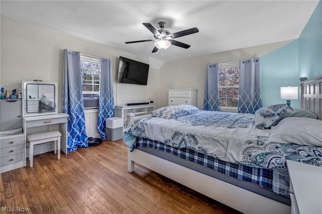 bedroom with wood-type flooring and ceiling fan