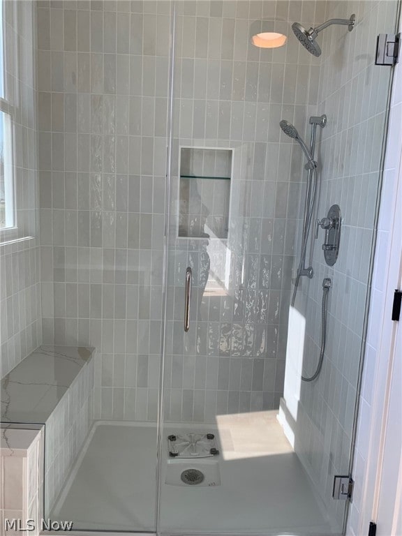 bathroom featuring an enclosed shower