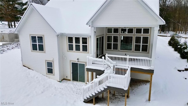 view of snow covered house