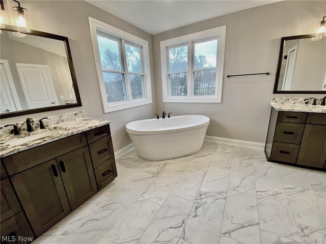 bathroom featuring vanity and a bathtub