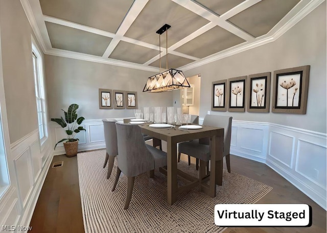 dining room featuring wood-type flooring, coffered ceiling, and ornamental molding