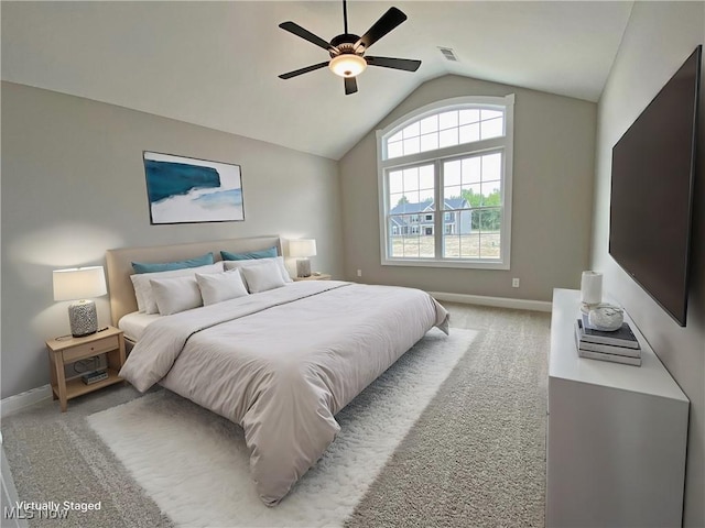 bedroom featuring ceiling fan, carpet, and lofted ceiling