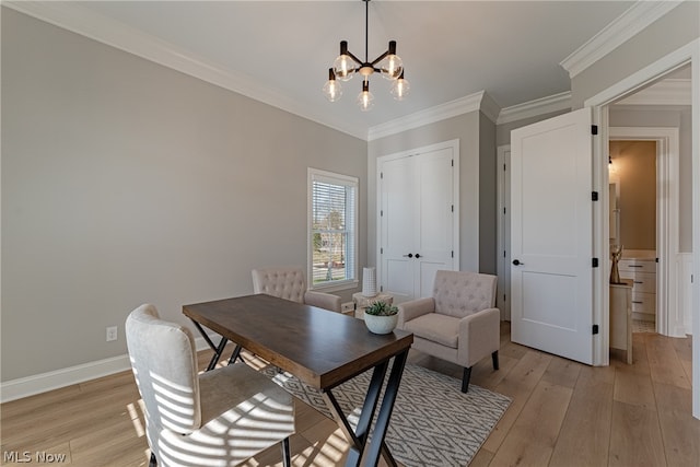 office area with light hardwood / wood-style flooring, a notable chandelier, and crown molding