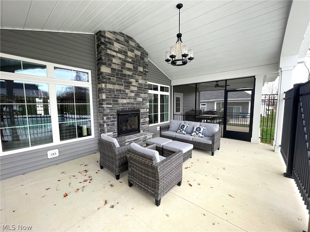 view of patio / terrace with an outdoor living space with a fireplace