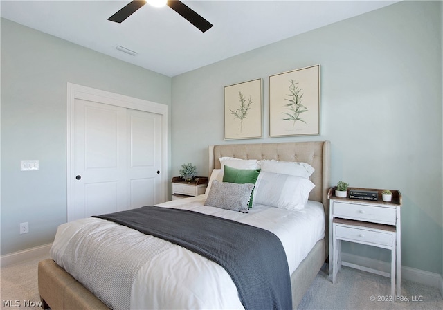 bedroom with a closet, carpet flooring, and ceiling fan