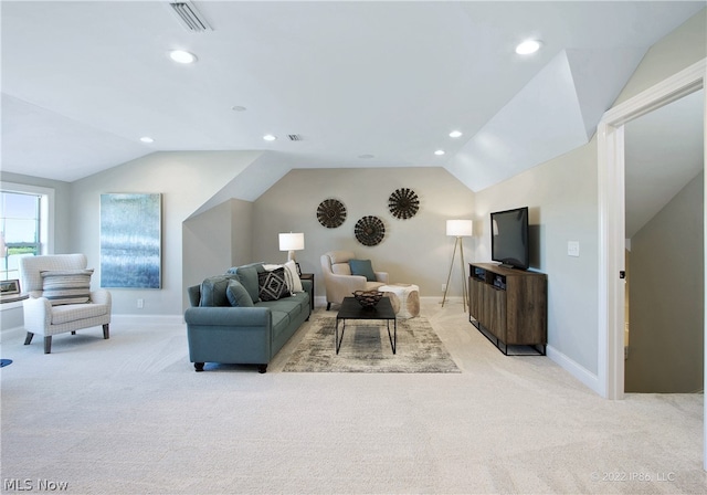 living room with lofted ceiling and light colored carpet