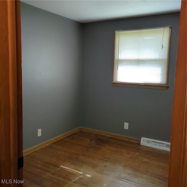 unfurnished room featuring wood-type flooring