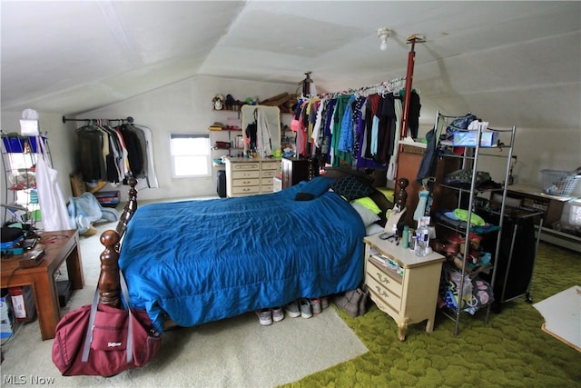 bedroom featuring carpet floors and vaulted ceiling